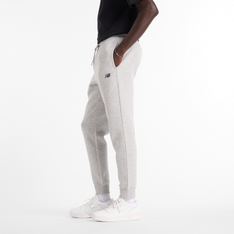 Спортивні штани New Balance SPORT FLEECE світло-сірі MP43904AG