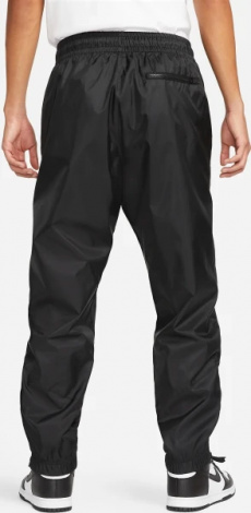 Спортивные штаны Nike WINDRUNNER WOVEN LINED PANTS черные DX0653-011