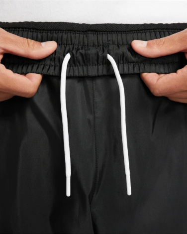 Спортивные штаны Nike WINDRUNNER WOVEN LINED PANTS черные DX0653-011