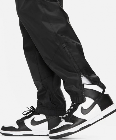 Спортивные штаны Nike WINDRUNNER WOVEN LINED PANTS черные DX0653-011
