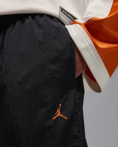 Спортивные штаны Nike JORDAN BROOKLYN DRAFT черно-оранжевые IB1047-011