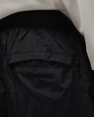 Спортивные штаны Nike JORDAN BROOKLYN DRAFT черно-оранжевые IB1047-011