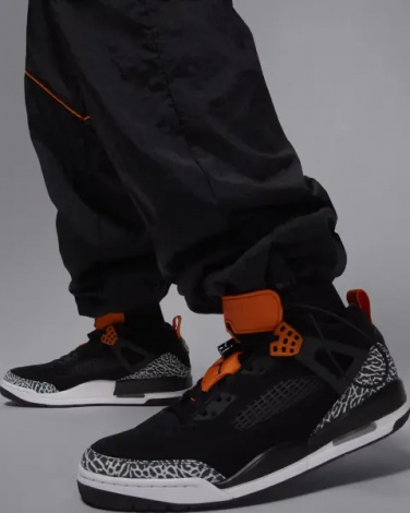 Спортивные штаны Nike JORDAN BROOKLYN DRAFT черно-оранжевые IB1047-011