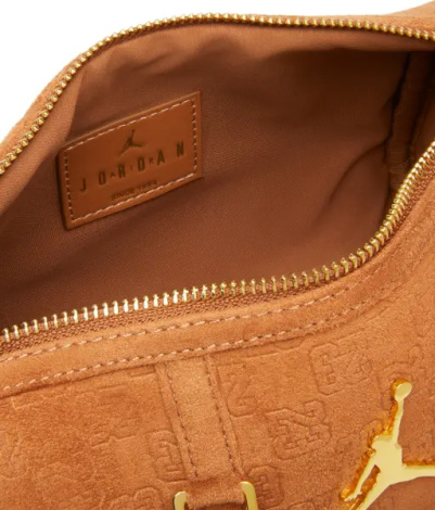 Сумка через плечо Nike JORDAN SUEDE MONOGRAM MINI DUFFEL 3L оранжевая MA9209-X6X